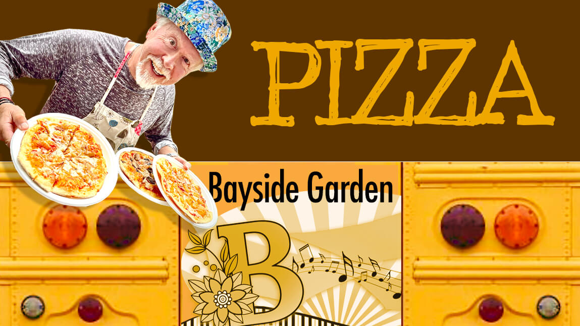 Michael Nikas holds three thin crust pizzas from a school bus